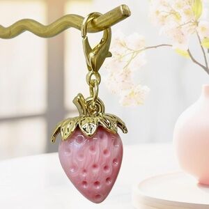 Pink strawberry purse charm with gold hardware